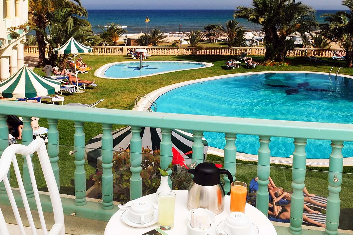 Breakfast terrace overlooking the pools and sea at Méhari Hammamet